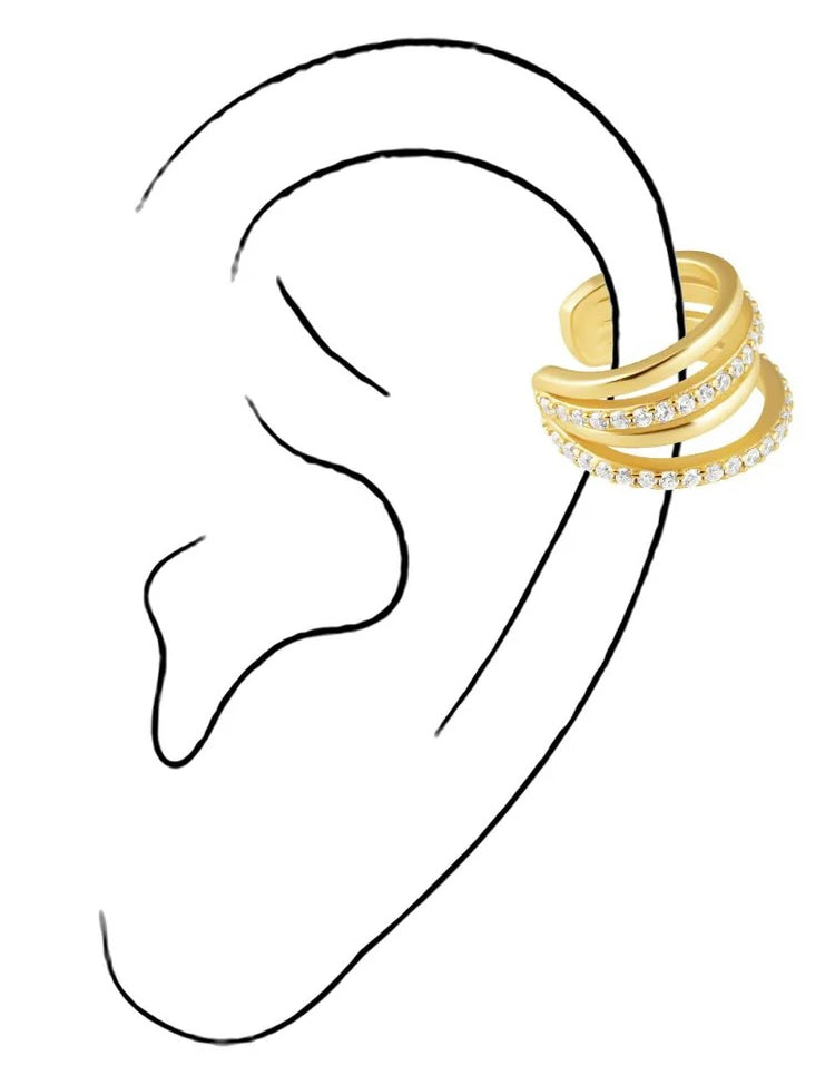Gold tone triple band ear cuff with crystal details worn on illustrated ear