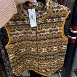 Cropped earth-tone animal print sherpa vest with zip front and mustard contrast trim on hanger
