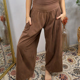Women wearing chocolate brown wide-leg lounge pants with fold-over waistband and side pockets