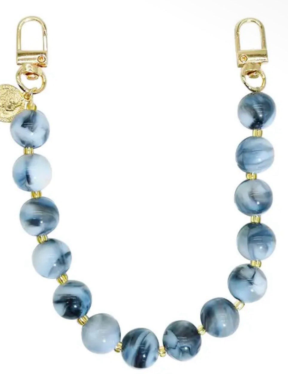 Blue marbled resin beaded bag chain strap with gold clasp hooks and small coin charm accent.