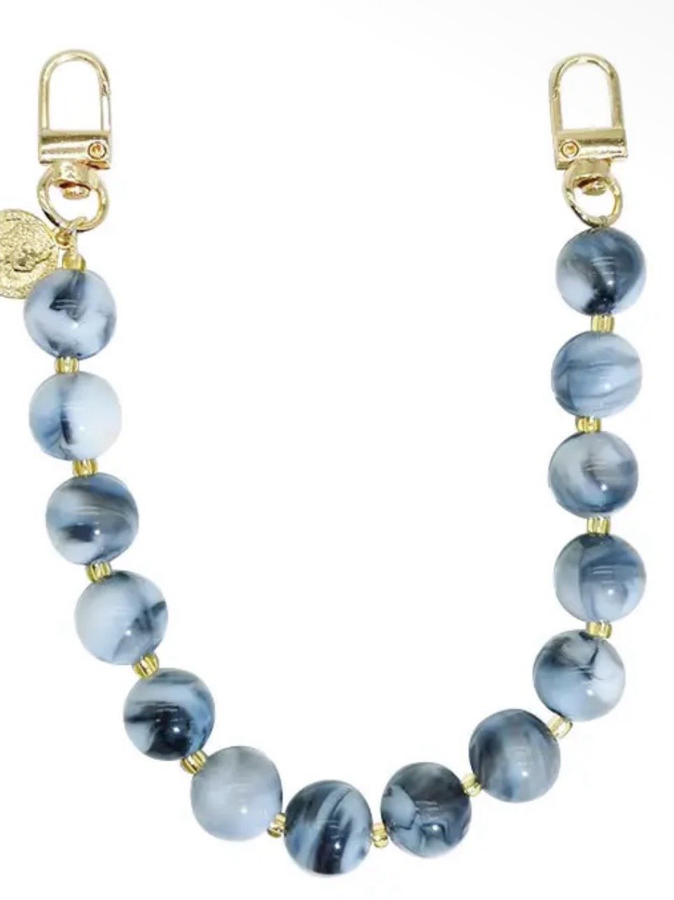 Blue marbled resin beaded bag chain strap with gold clasp hooks and small coin charm accent.