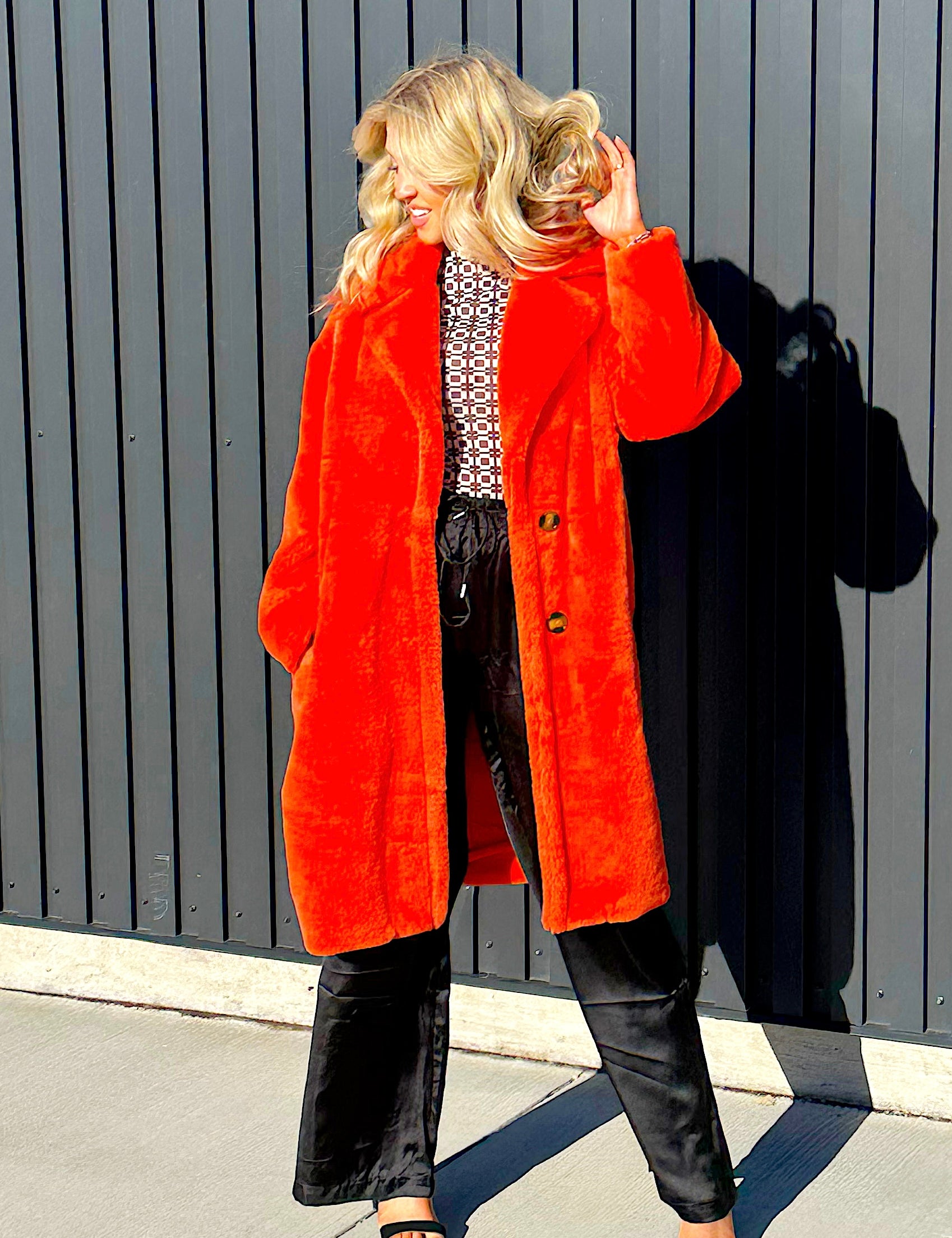 Steve Madden faux fur jacket, fully lined two buttons and bright red/oragne in color